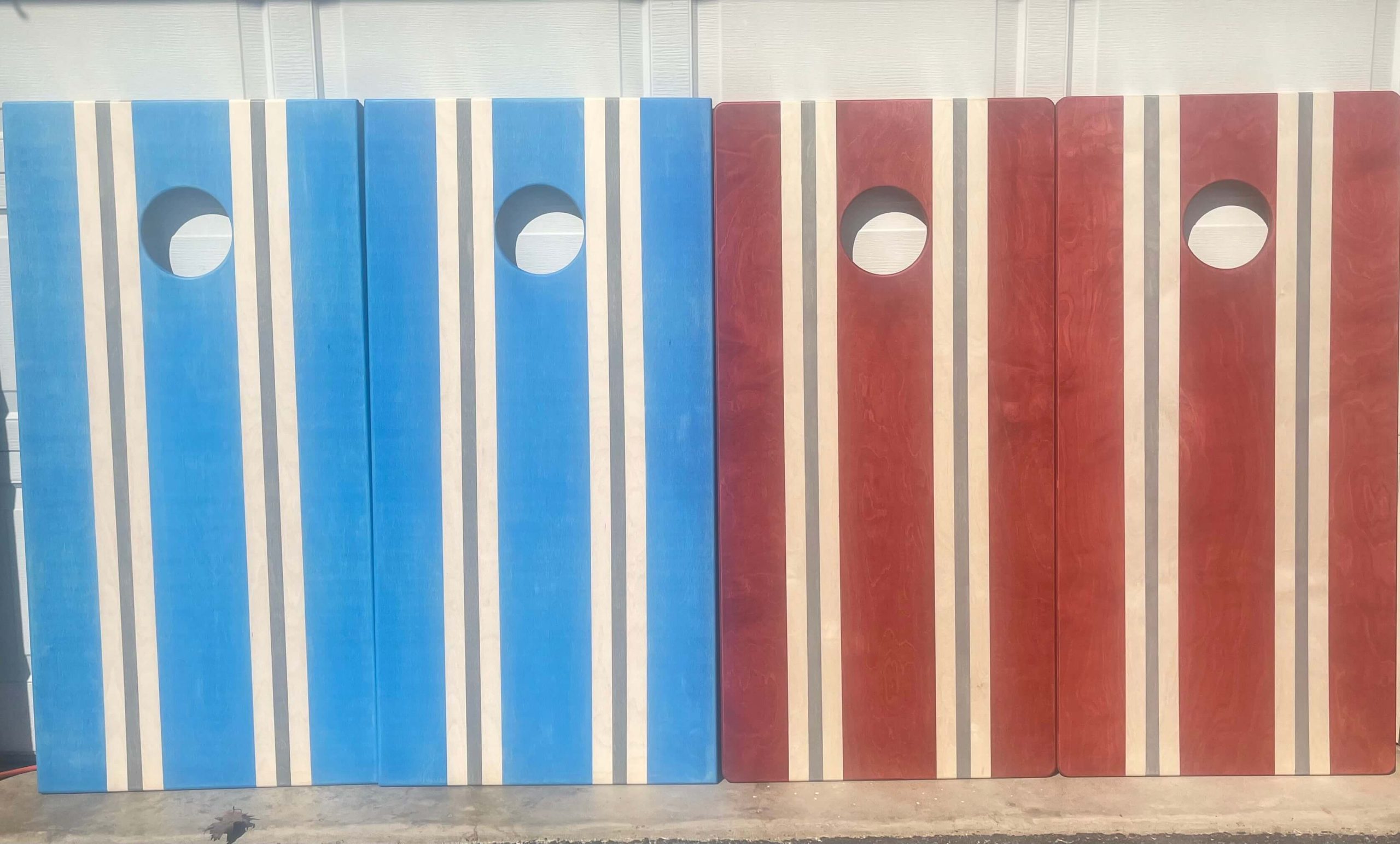 matching red and blue cornhole boards