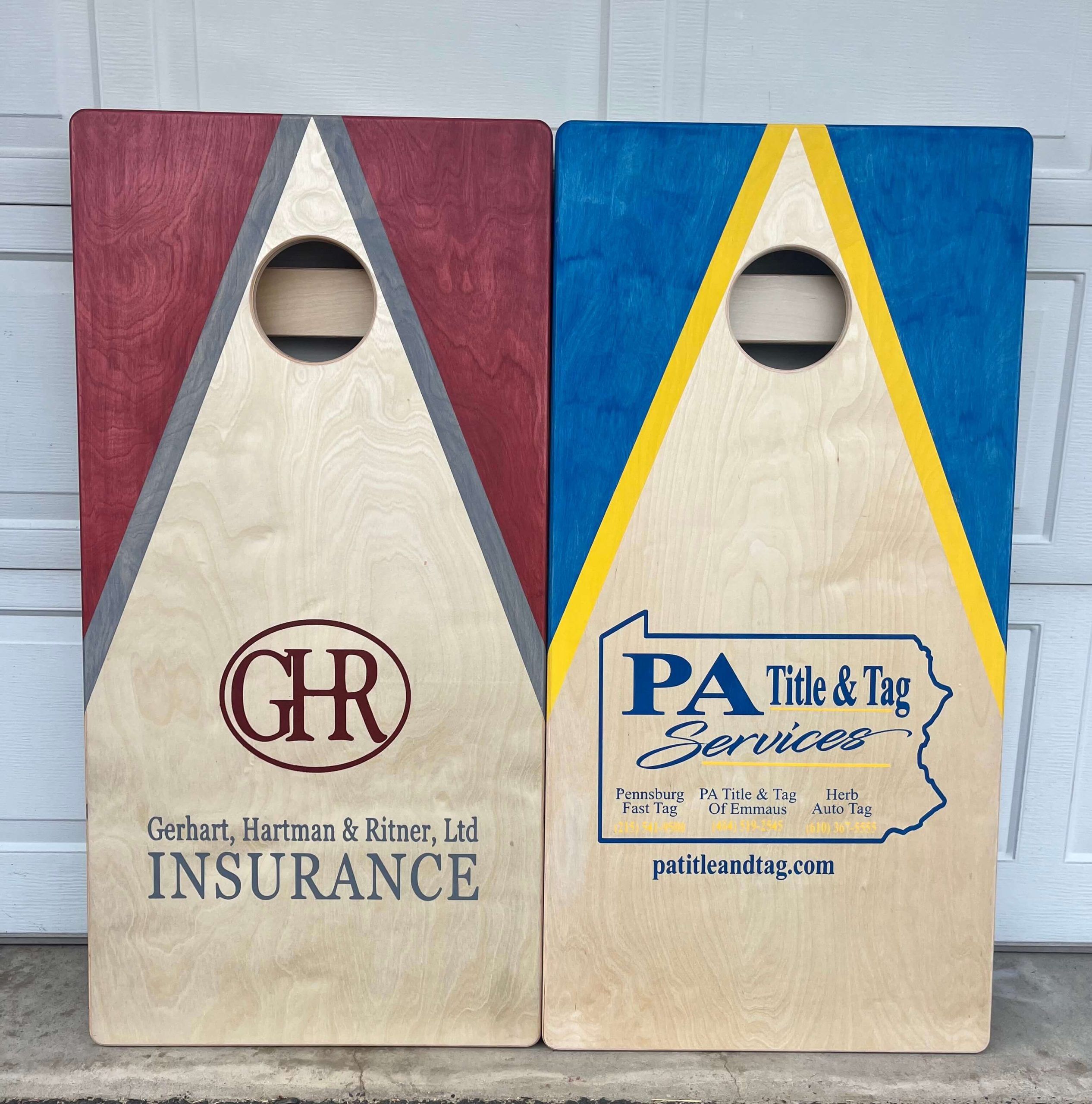 pair of sponsored cornhole boards from boyertown businesses ghr insurance and pa title and tag services